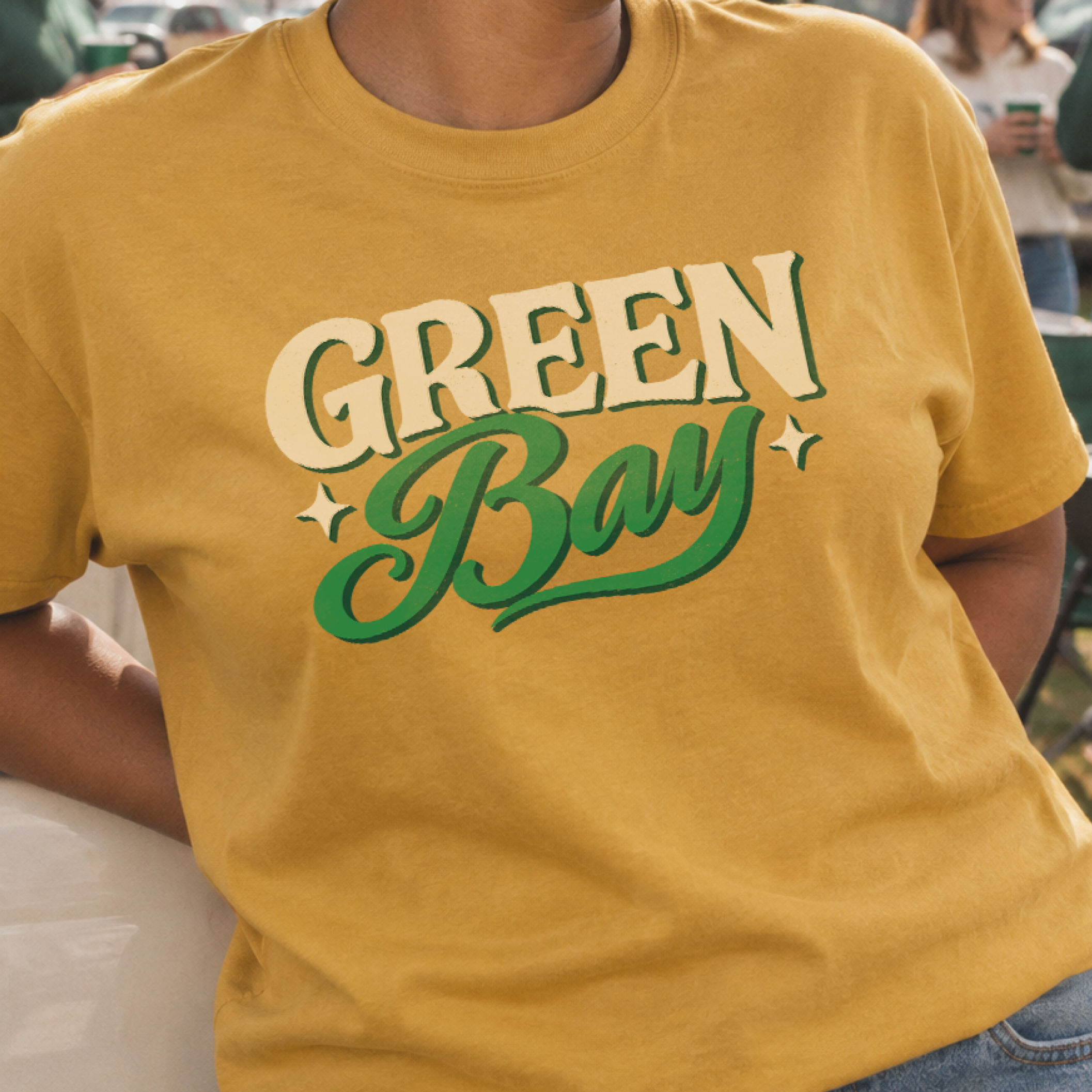 ’Tis the Damn Season Green Bay Tee in Mustard, on model