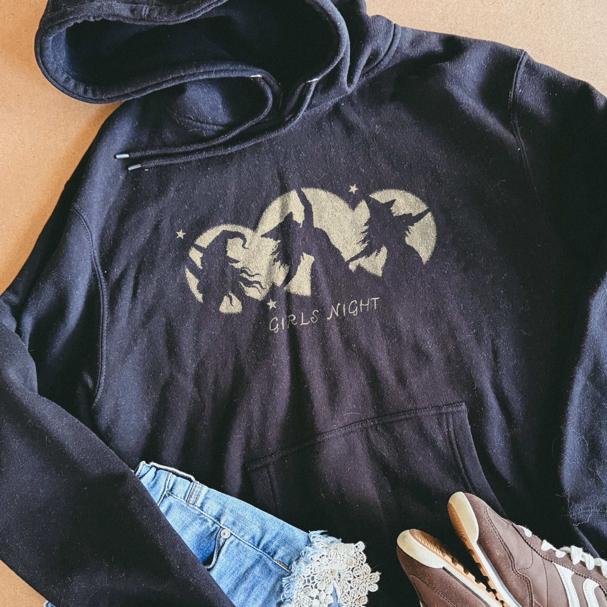 Girls Night Hoodie in Black, flat lay with jeans and sneakers