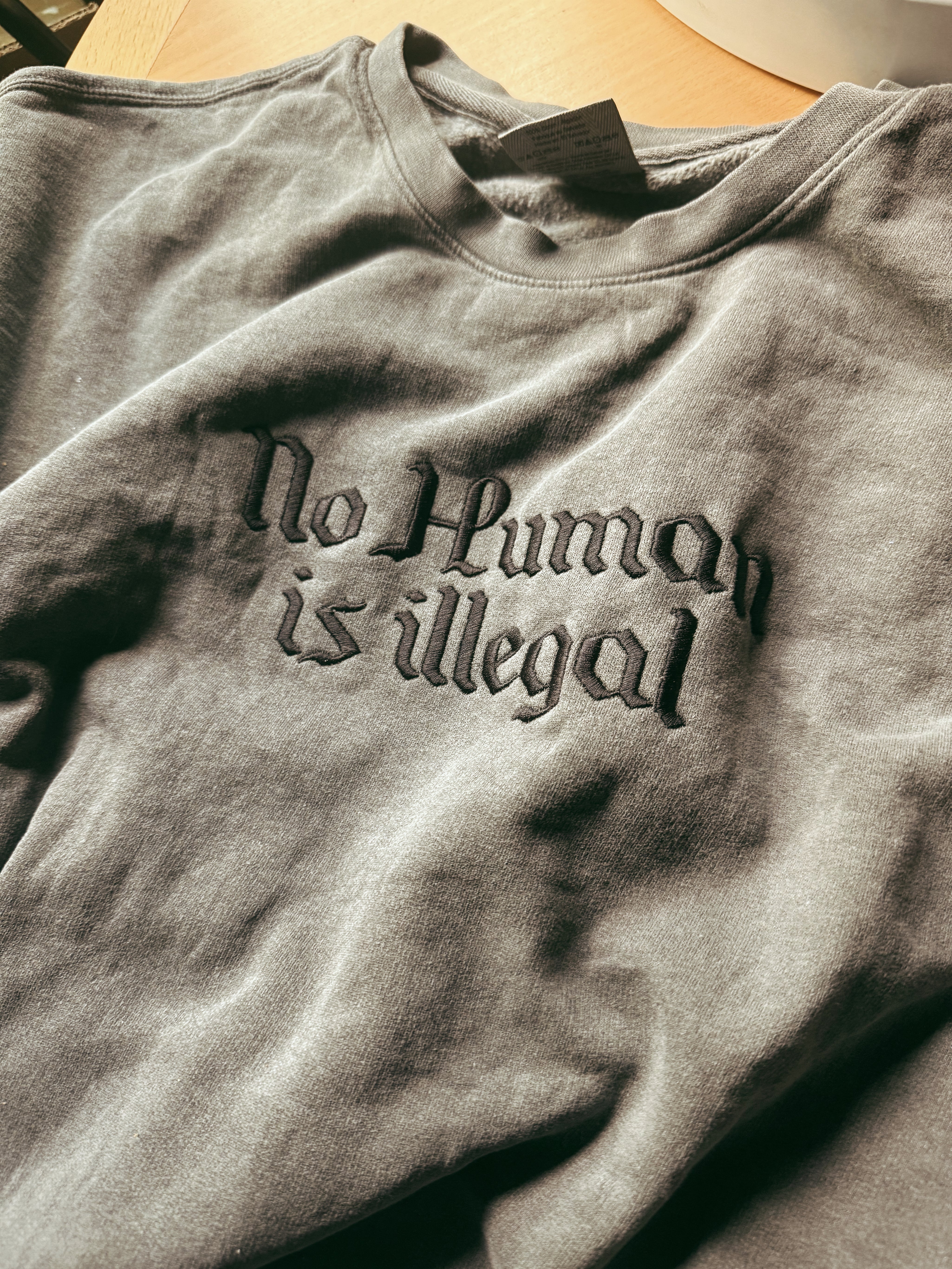 No Human is Illegal Embroidered Crewneck
