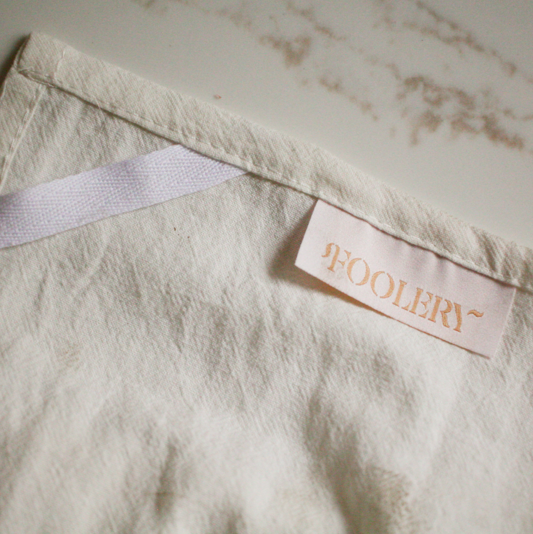 The Champagne Problems Tea Towel