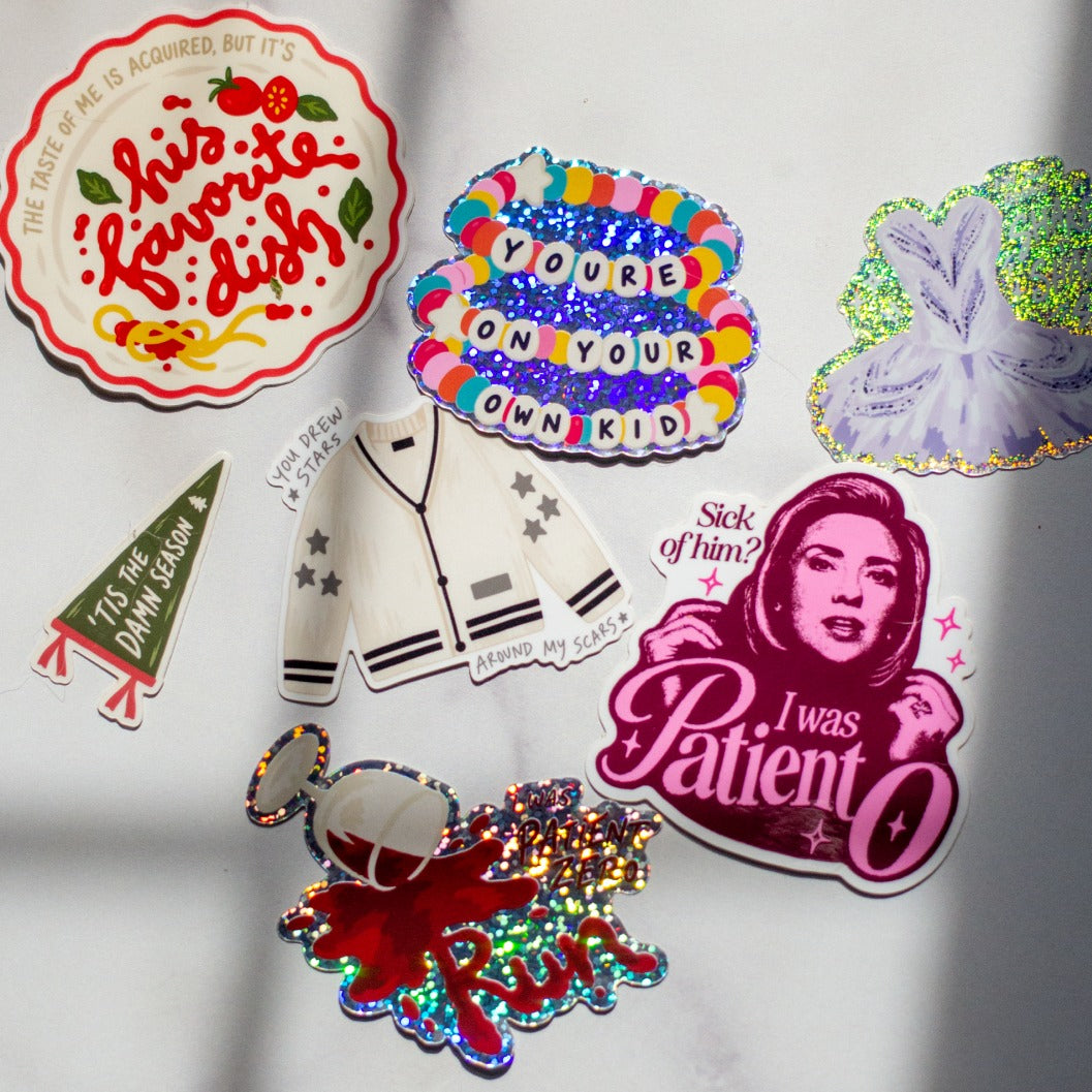 The full Foolery sticker lineup on marble