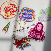 The full Foolery sticker lineup on marble
