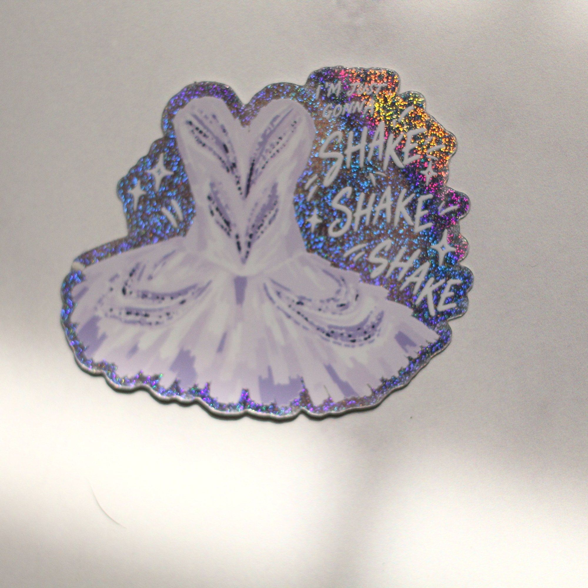 Shake Shake Shake holographic tutu sticker on marble